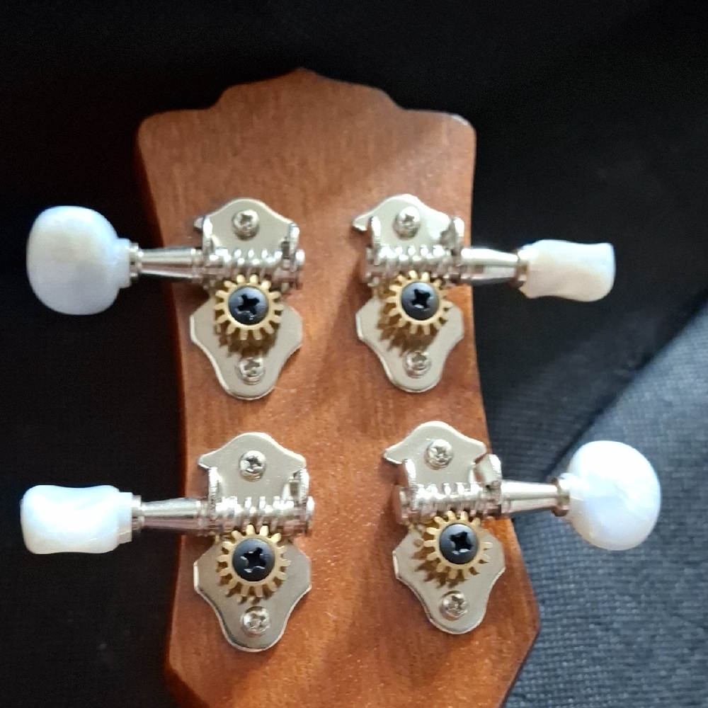 Intricately Carved Brown Ukulele - Picture 5 of 7